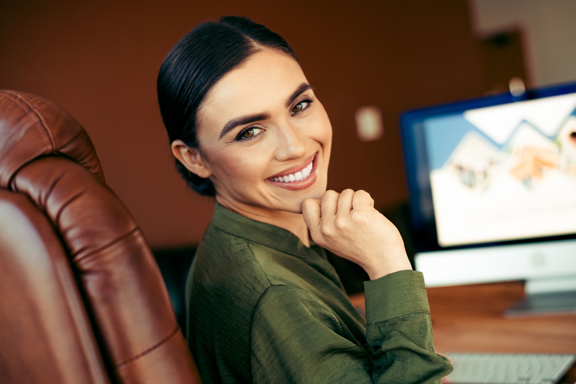Young professional woman with confidence working in a bright office space
